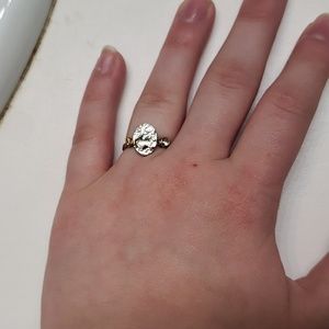 Hammer crafted silver ring with glass stones on either side of center peice